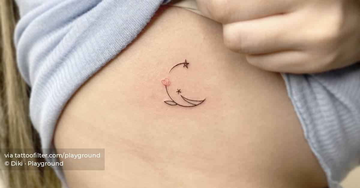 Fine line style flower moon tattoo placed on the side