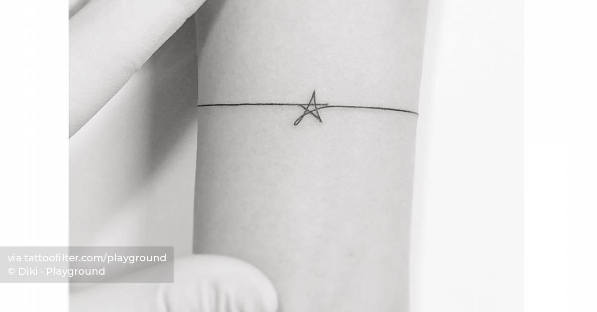Fine line style star wristband tattoo.