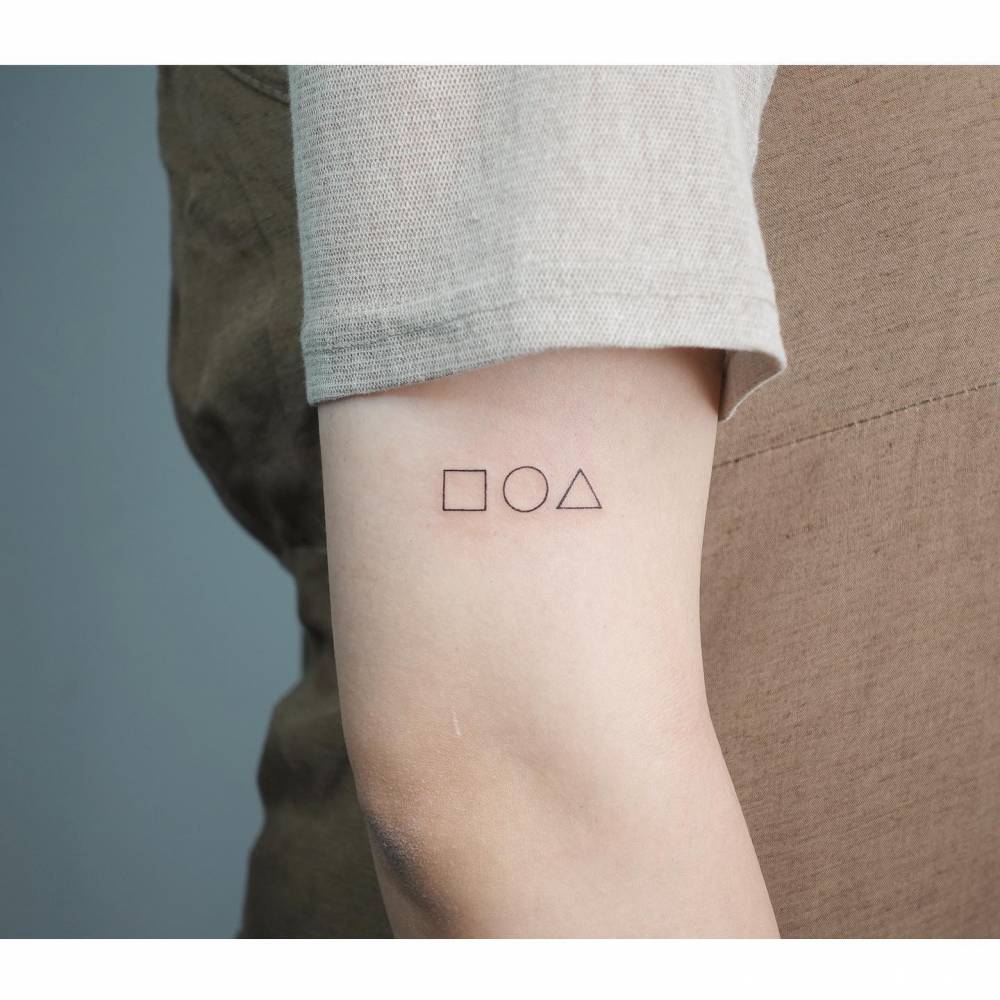 Square Circle And Triangle Tattoo Located On The Upper