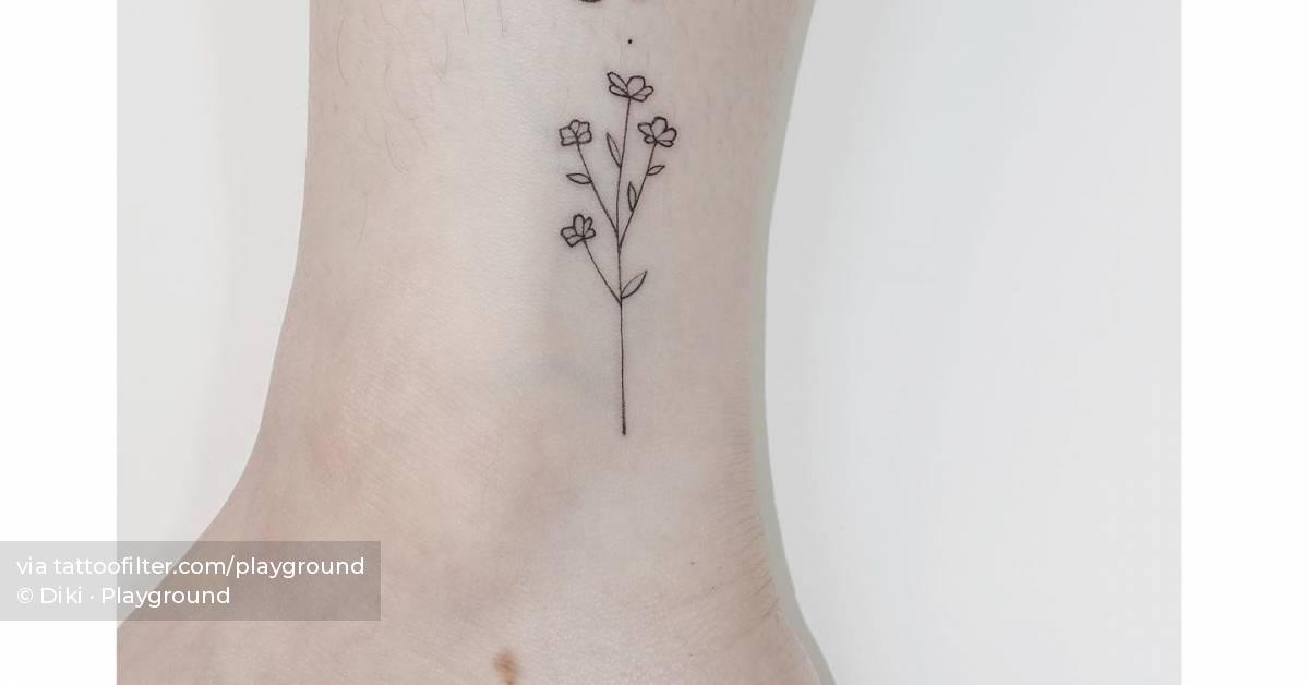 Fine line style flower tattoo done on the ankle.