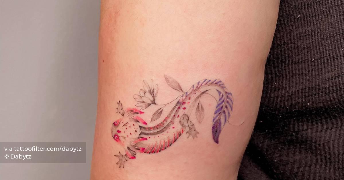 Contemporary axolotl tattoo located on the tricep.
