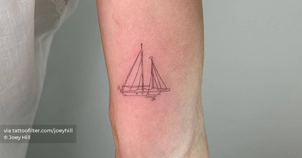 Tattoo of a sailboat in fine line located on the inner
