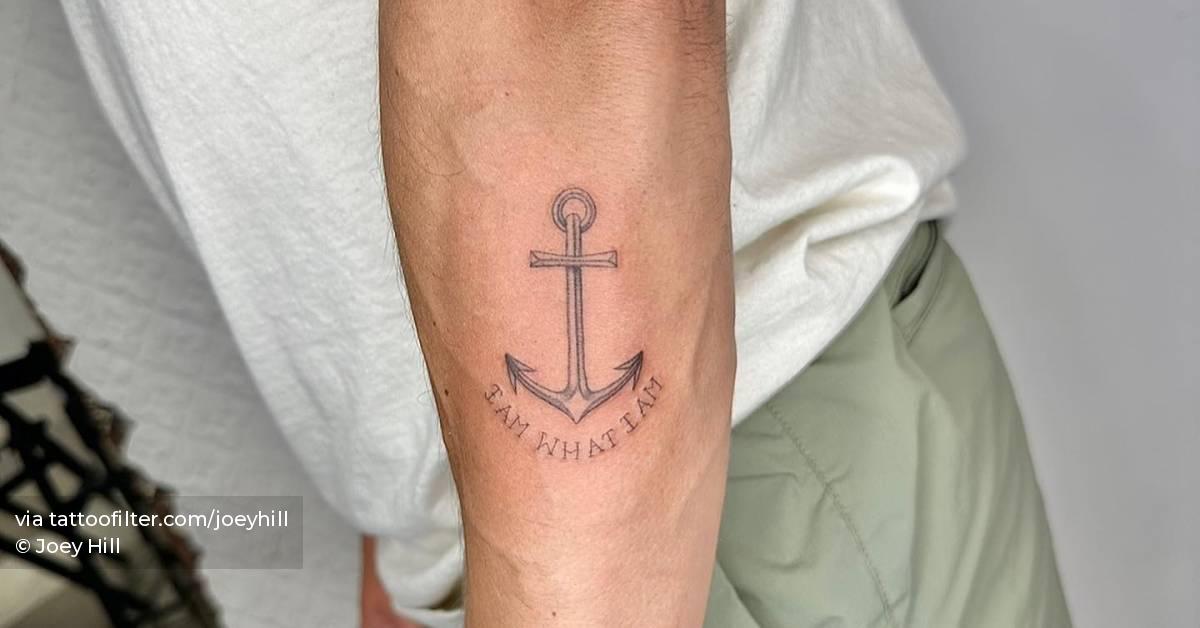 Anchor and "I am what I am" tattoo located on the