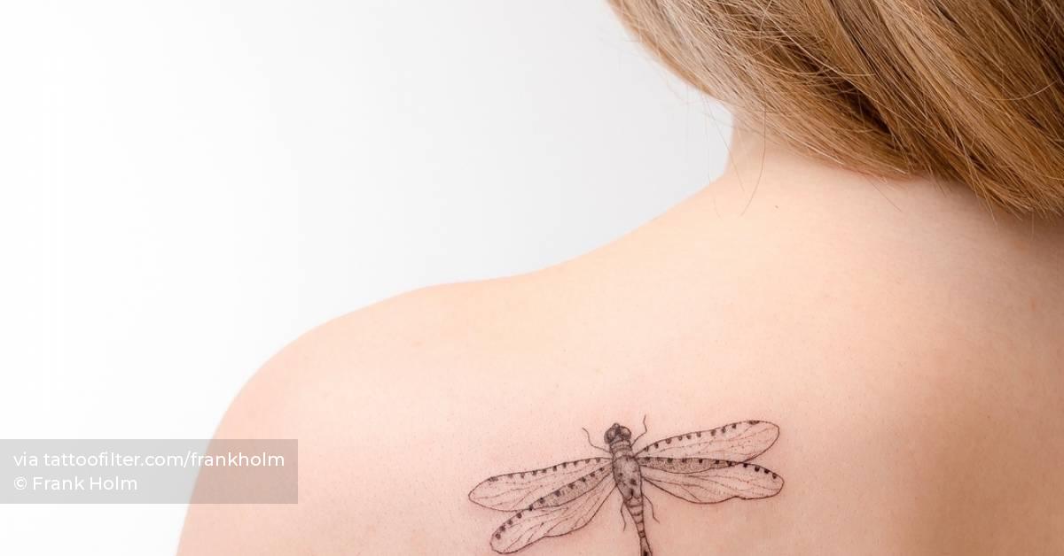 Dragonfly tattoo located on the shoulder blade,