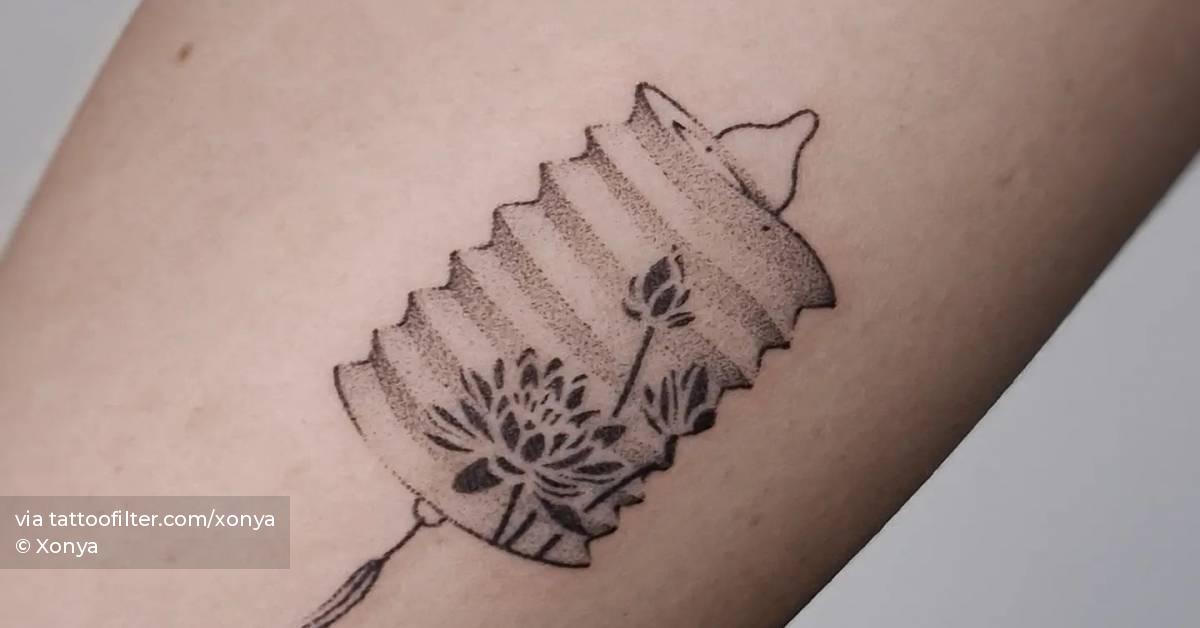 Hand poked lantern tattoo located on the inner arm.