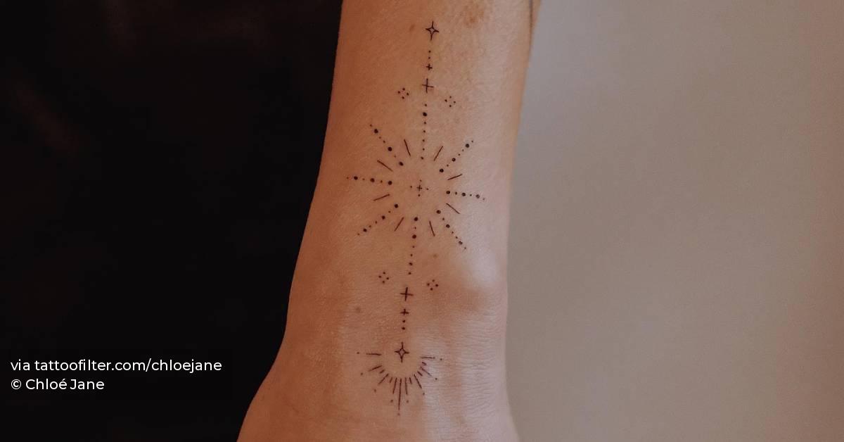Fine line style ornament tattoo located on the wrist.