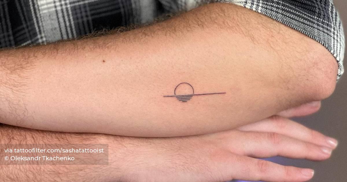 Minimalistic style sea sunset tattoo located on the