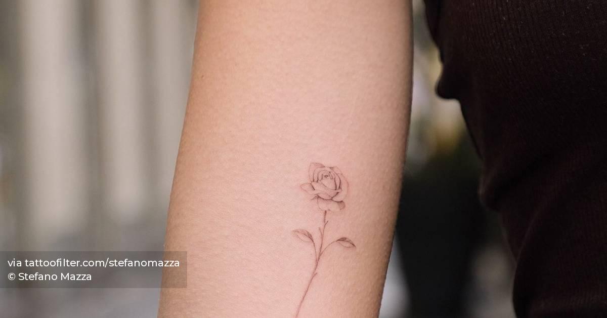 Single needle rose tattoo done on the inner arm.