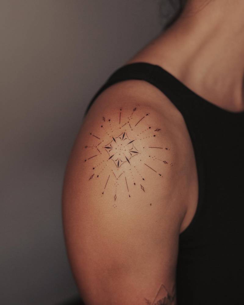 Fine Line Style Ornamental Tattoo Located On The