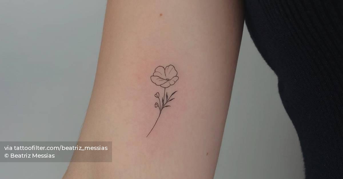 Minimalistic style poppy flower tattoo located on the