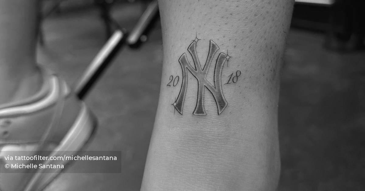 New York Yankees logo tattooed on the ankle.
