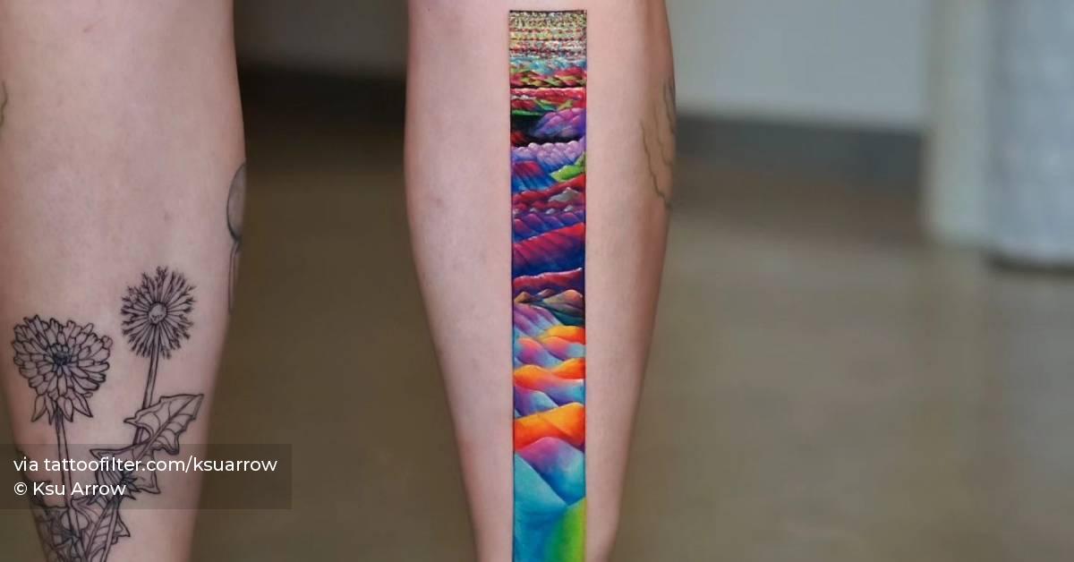 Colorful pattern tattoo located on the shin,