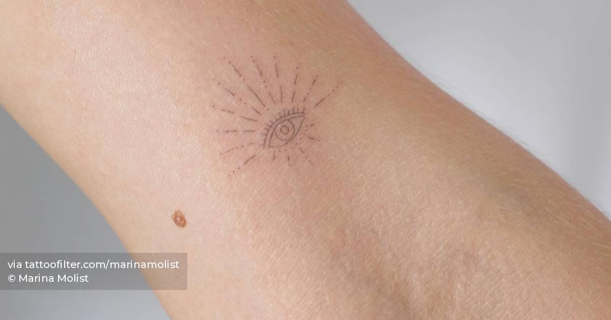 Fine line style evil eye and number "13" tattoos
