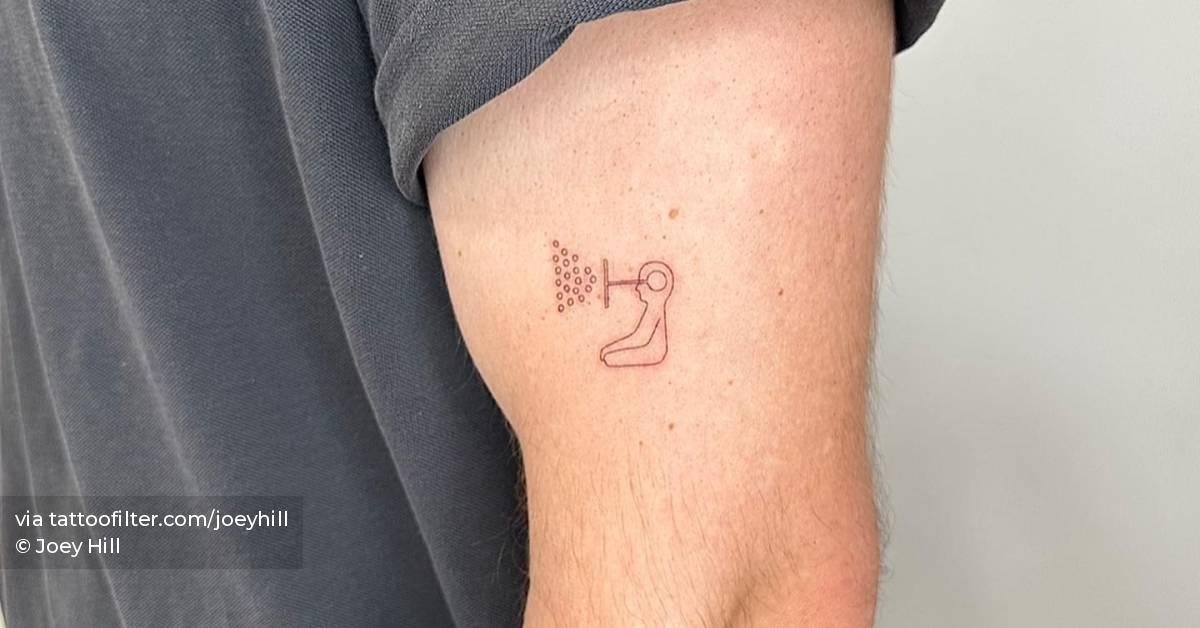 Fine line style tattoo located on the upper arm.