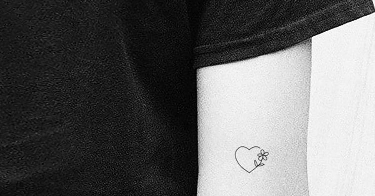 Minimalist heart and flower temporary tattoo done on