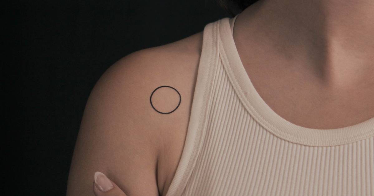 Minimalistic style circle temporary tattoo located on