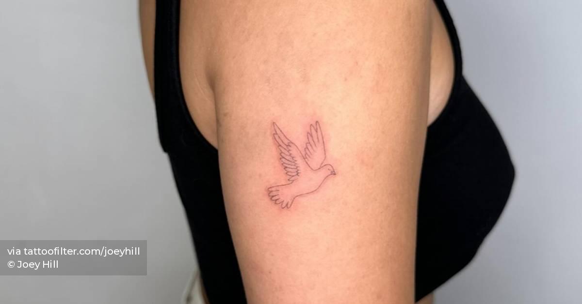 Single needle dove tattoo located on the upper arm.