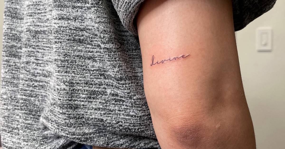 tattoo-of-the-word-divine-handwritten-on-the-tricep