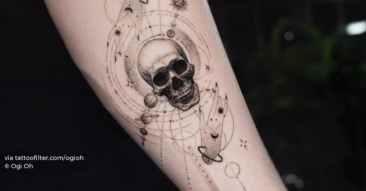 Graphic style skull and universe tattoo located on the