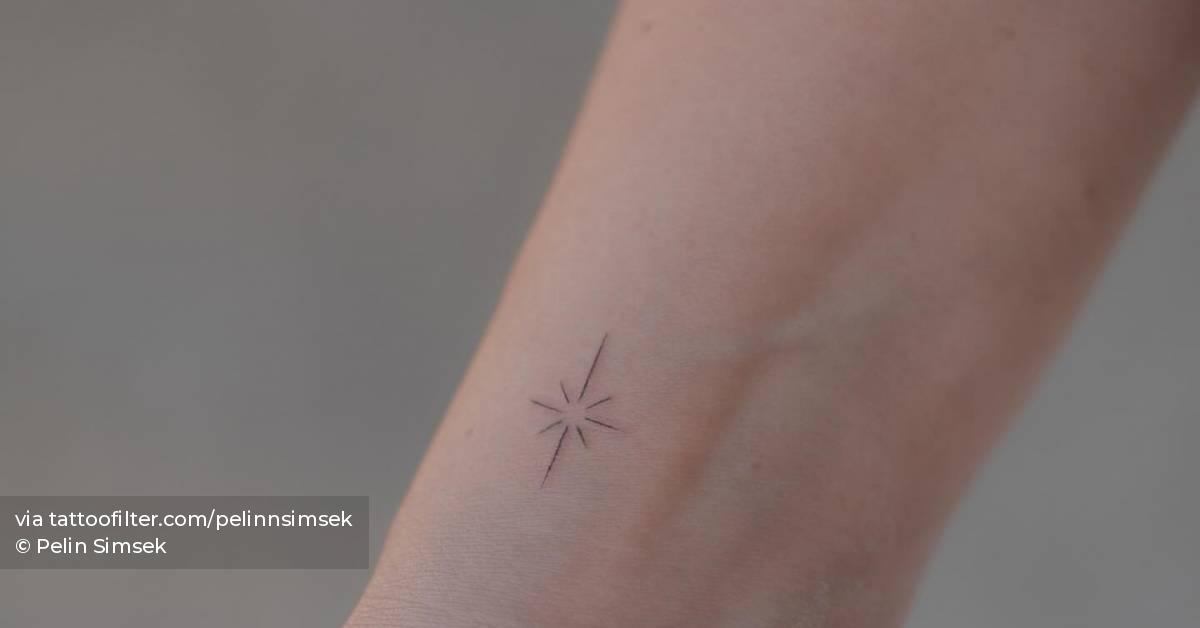Fine line style north star tattoo done on the wrist.