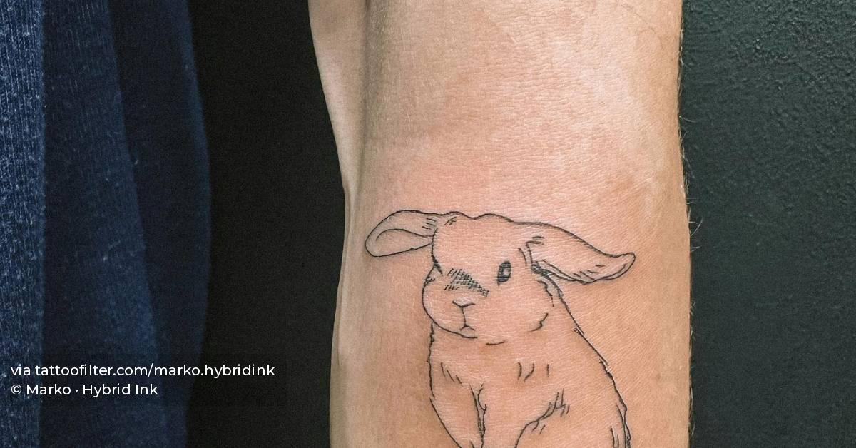 Fine line style rabbit tattoo located on the forearm.