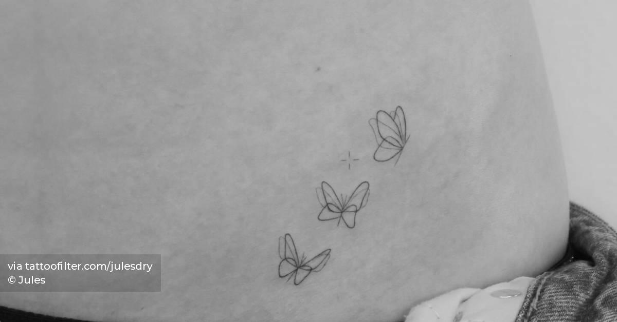 Fine line style butterflies tattoo located on the hip.