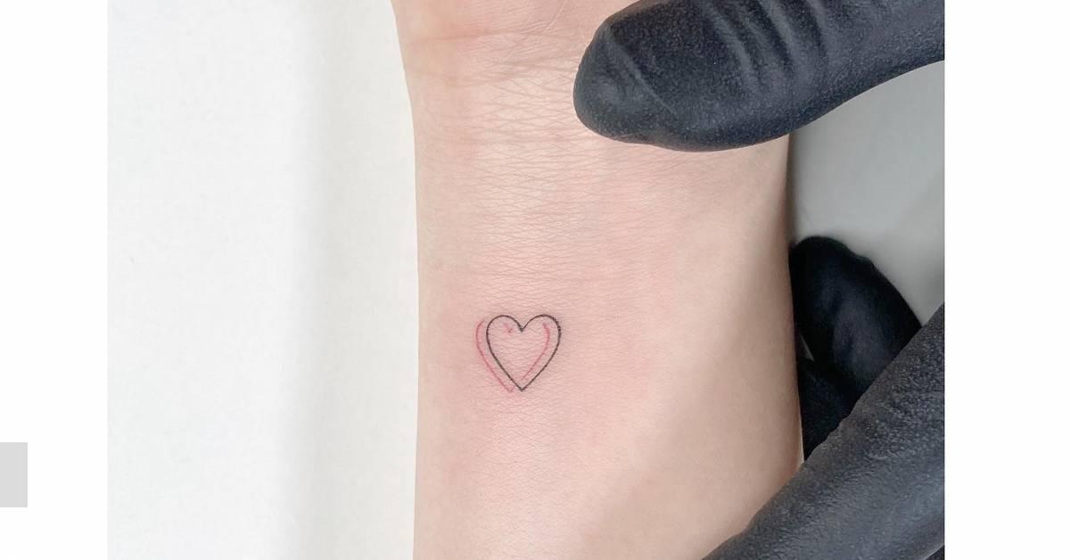 Minimalistic heart tattoo located on the wrist.