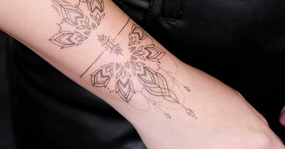 Ornamental bracelet tattoo located on the wrist, fine