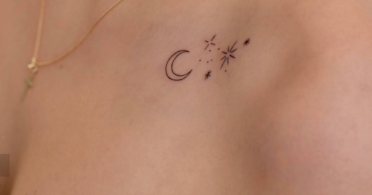 Minimalistic style moon and stars tattoo located on the