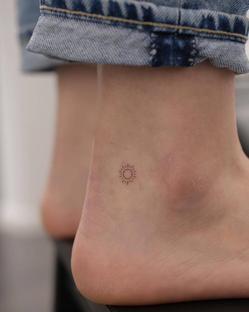 Tiny Minimalistic Sun Tattoo Placed On The Ankle Tiny Minimalistic Sun Tattoo Placed On The Ankle