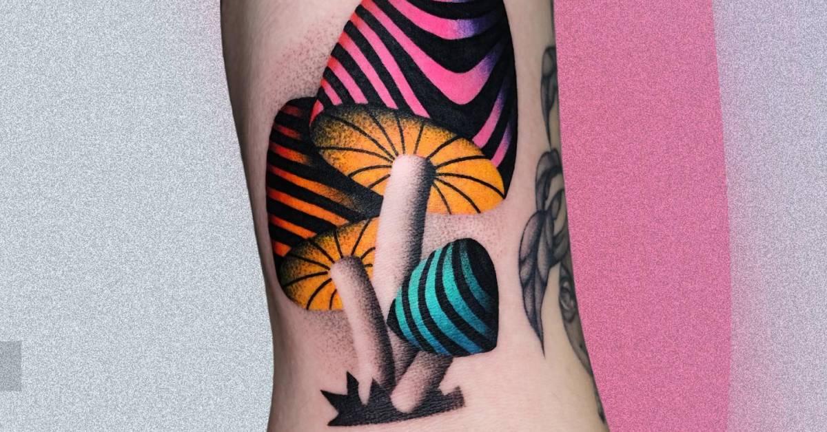 Psychedelic mushrooms tattoo located on the bicep.