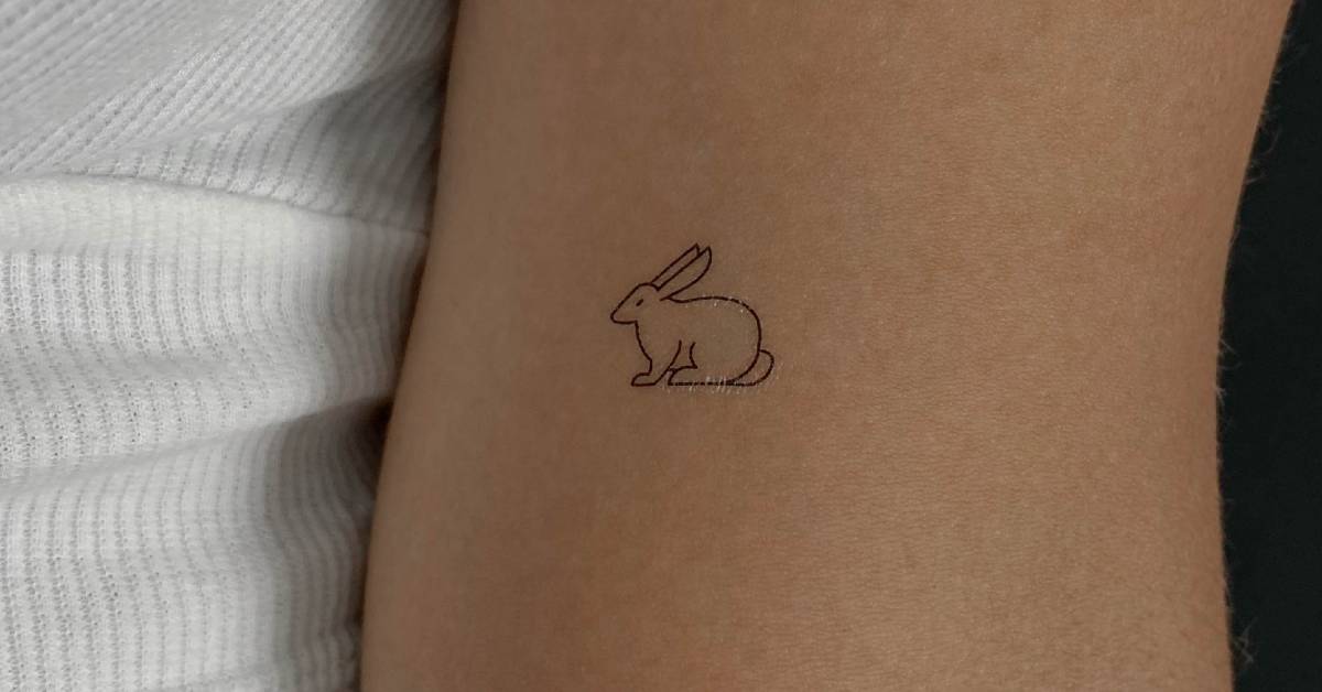 Fine line style rabbit temporary tattoo located on the