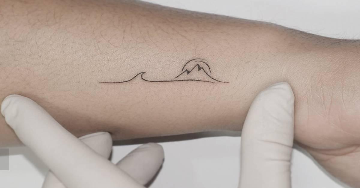 Minimalistic Style Mountain And Wave Tattoo Located On minimalistic-style-mountain-and-wave-tattoo-located-on
