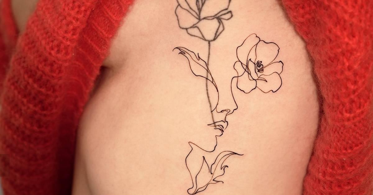 Flower head woman tattoo located on the rib, sketch