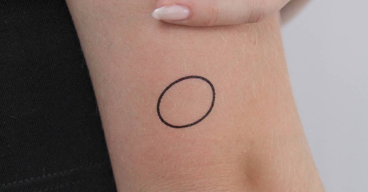 Circle temporary tattoo done on the tricep,