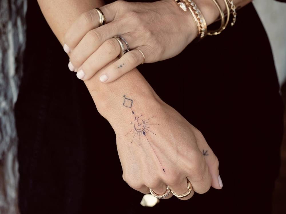 Fine Line Style Ornamental Tattoo Located On Elsa