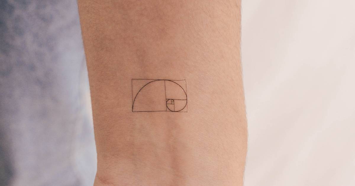 Small golden spiral temporary tattoo