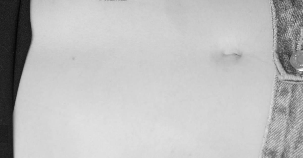 Tattoo of the word "ohana" located on the stomach.