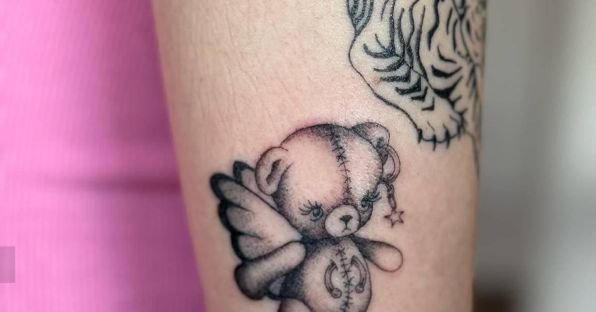 Illustrative style teddy bear tattoo located on the