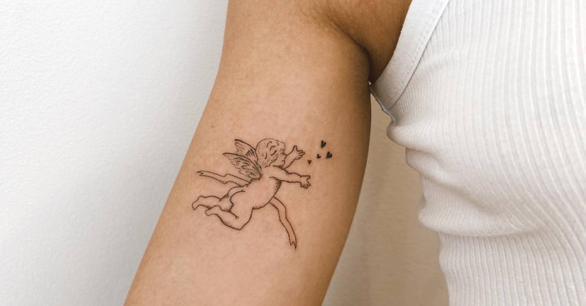 Cherub tattoo placed on the inner arm, hand poked