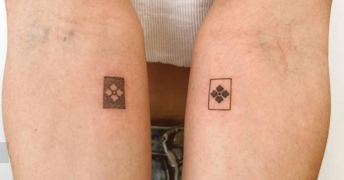 Individual matching ornament tattoos hand poked on the