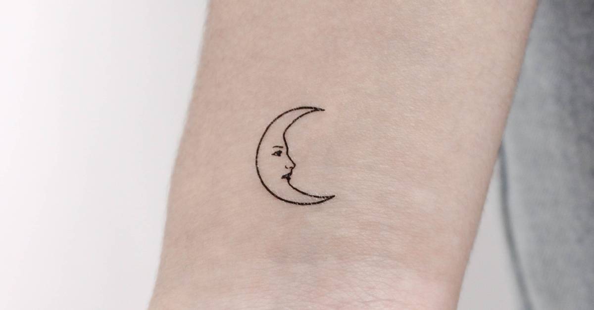 Fine line style crescent moon face temporary tattoo