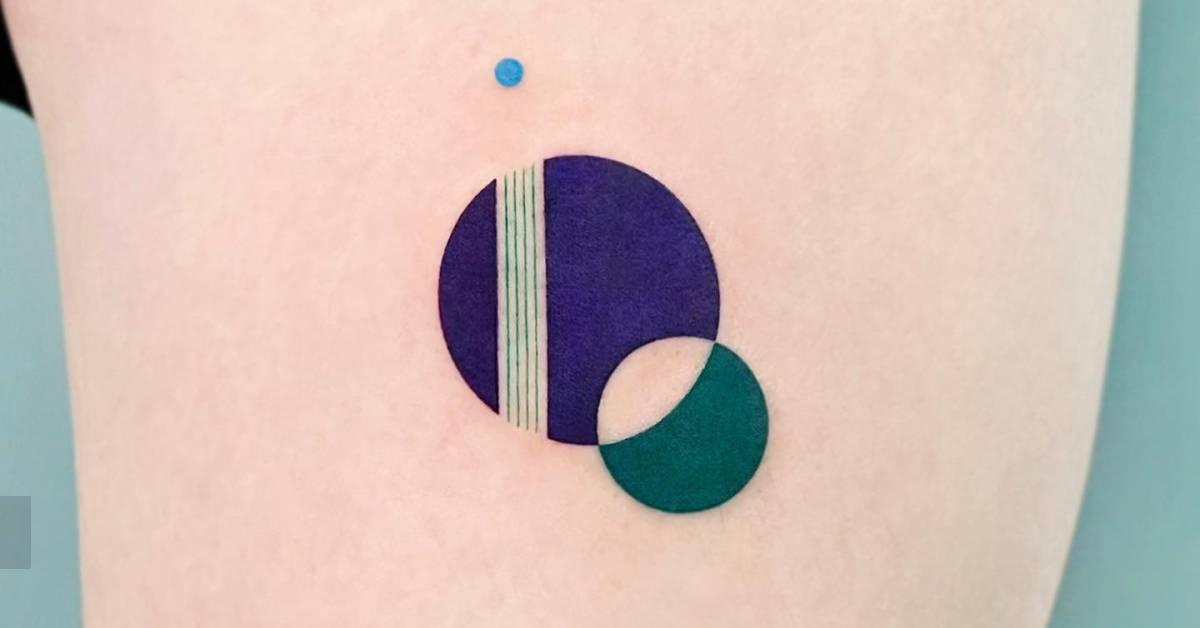 Abstract circles tattoo located on the upper arm.