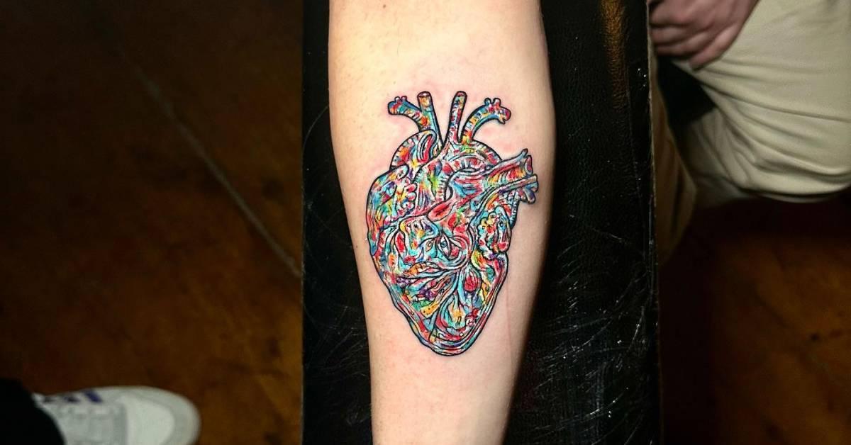 Colorful anatomical heart tattoo located on the inner