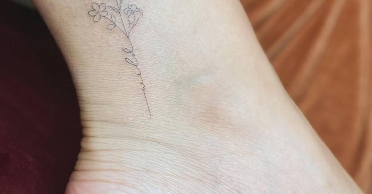 Flower bouquet tattoo in fine line style located on the