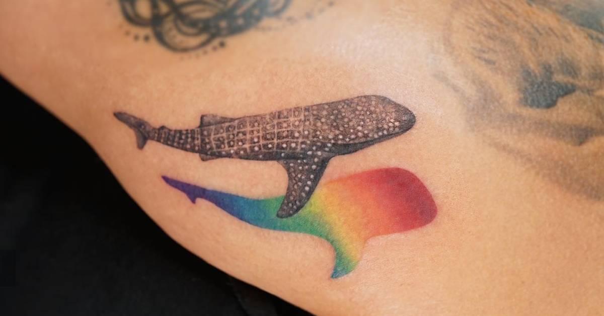 Watercolor style whale shark tattoo located on the