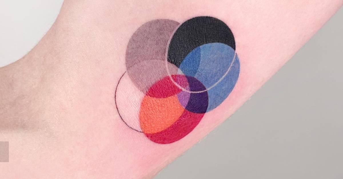 Abstract circles tattooed on the inner arm, geometric