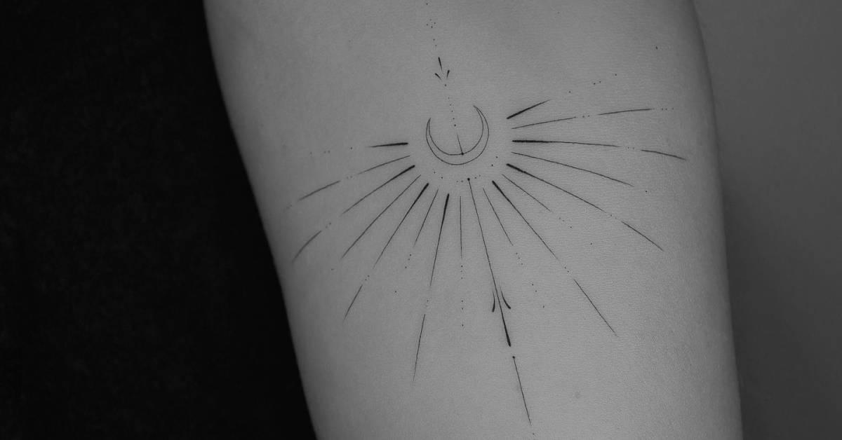 Fine line style ornamental tattoo located on the inner