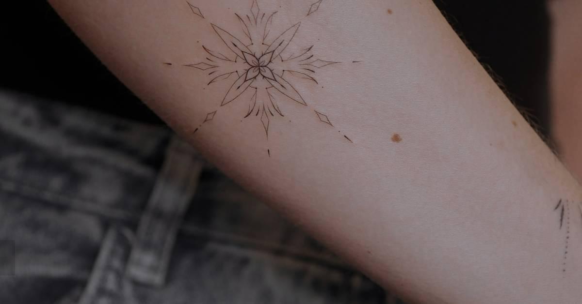 Ornamental tattoo in fine line style located on the