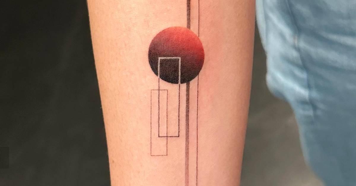 Abstract geometric tattoo located on the inner forearm.